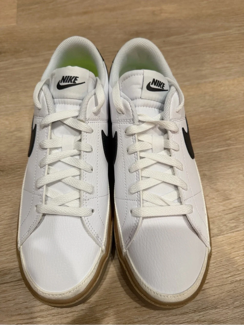 Nike Women's White Sneakers with Black Swoosh and Gum Sole